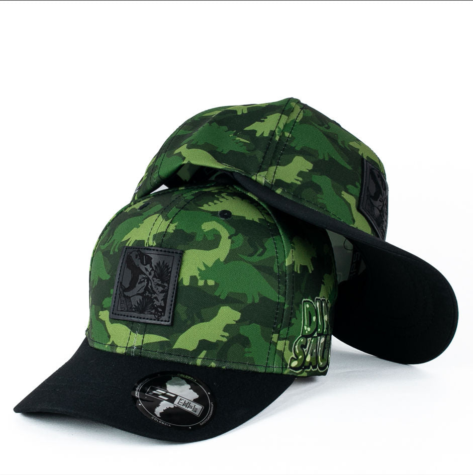 Gorra Multimarca Camo con Estampado de Dinosaurios y Parche de Cuero.