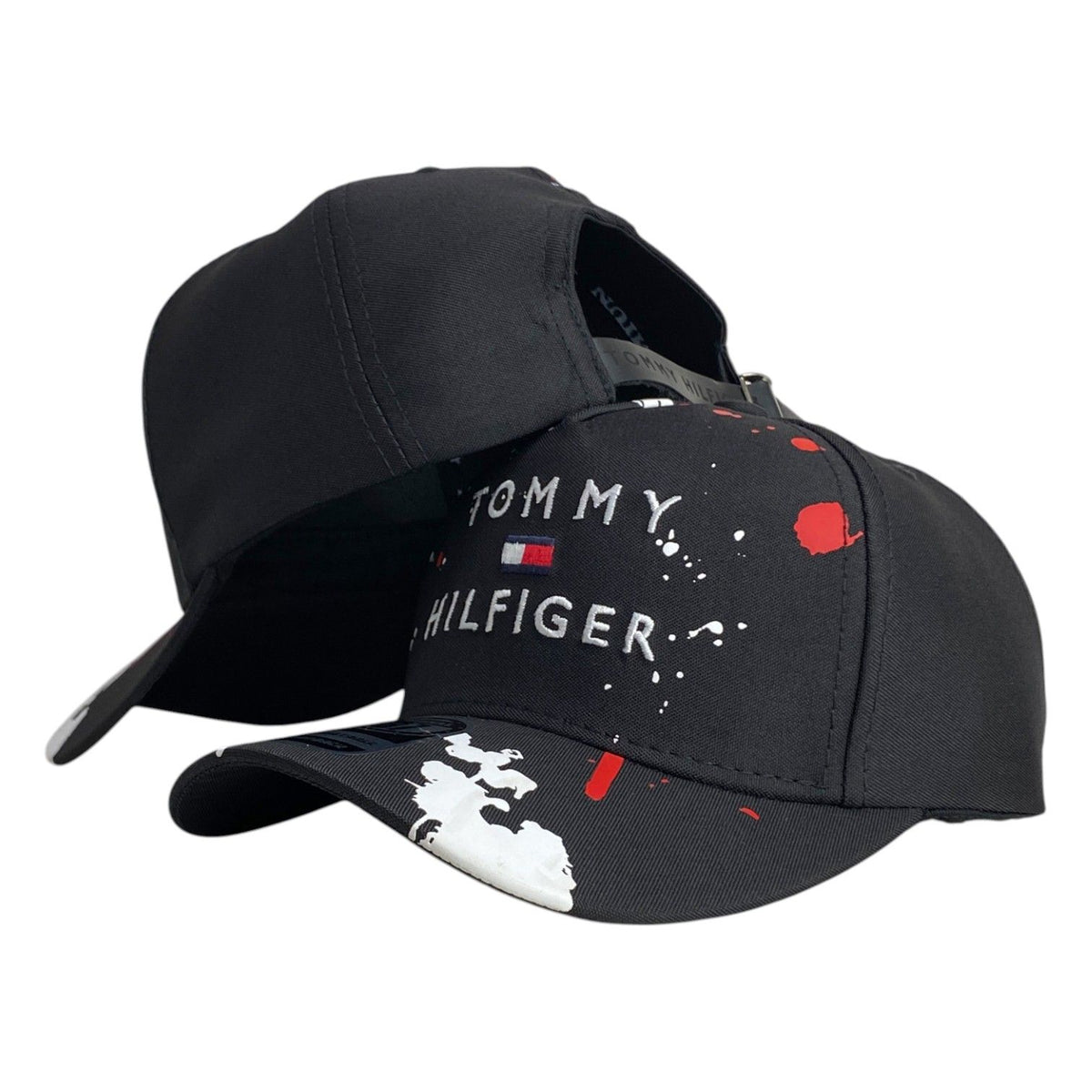Gorra Tommy Negra con Estampado de Salpicaduras y Bordado en Relieve.