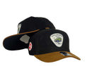 Gorra Toyota Negra en Gamuza con Visera Miel y Parche Conmemorativo.