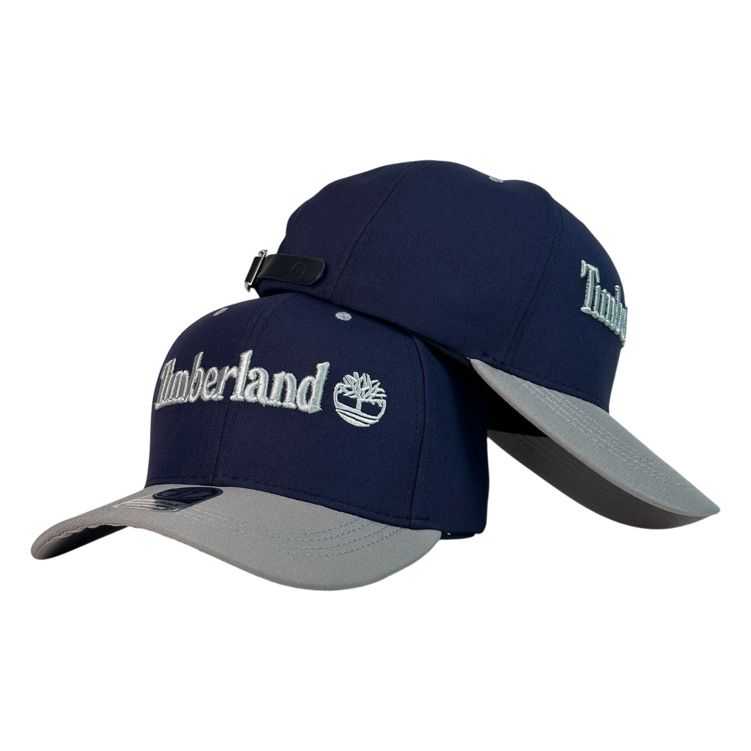 Gorra Timberland Azul con Visera Gris y Bordado en Relieve.