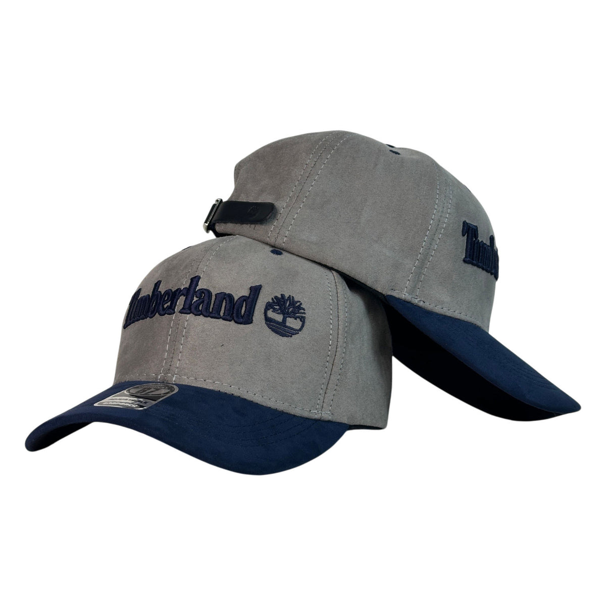 Gorra Timberland Gris en Gamuza con Visera Azul y Bordado en Relieve.