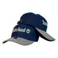 Gorra Timberland Azul en Gamuza con Visera Gris y Bordado en Relieve.