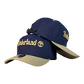 Gorra Timberland Azul con Visera Beige y Bordado en Relieve.