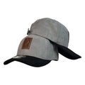 Gorra Full Caps Gris en Gamuza con Visera Negra y Parche de Cuero.