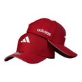 Gorra Adidas Roja con bordado en relieve y visera con borde gris.